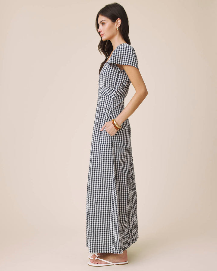 black white gingham dress Wrap It has two pockets for your everyday essentials Black and White Gingham Tie