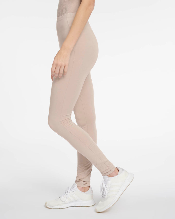 Top and Women's Sportswear Leggings in Beige microfiber with push-up,  supportive, ribbed modeling effect, made in Italy.