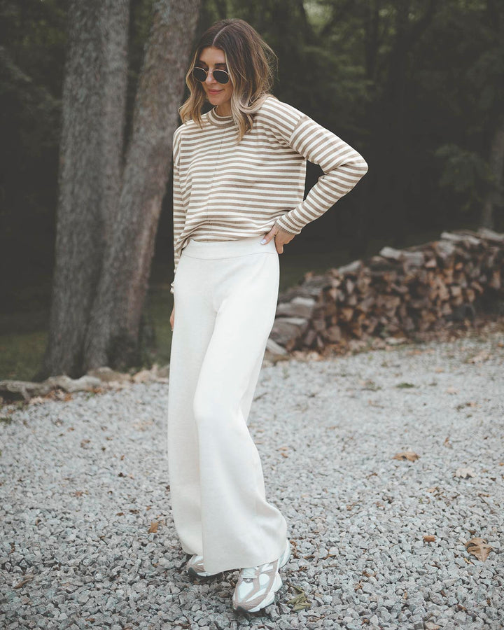 Oversized Knits and Flares | A Fall Uniform | Cable knit sweater outfit,  Cable sweater outfit, Knit pants outfit